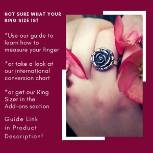 May include: A silver ring with a rose design, worn on a hand with pink flowers. The text "NOT SURE WHAT YOUR RING SIZE IS?" is in the top left corner. The text "*Use our guide to learn how to measure your finger * or take a look at our international conversion chart * or get our Ring Sizer in the Add-ons section Guide Link in Product Description!" is in the bottom left corner.