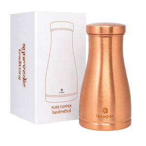 May include: A copper water bottle with a matching lid stands next to its white box. The box features a line drawing of the bottle and the words "Pure Copper Handcrafted". The bottle has the "ikopper" logo.