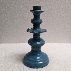 May include: A white ceramic mug with a black handle and the text "But First, Coffee" in a bold, black font. The mug is displayed on a white surface, showcasing its clean design.