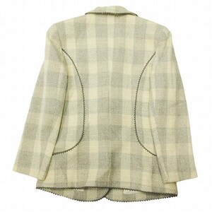 May include: A light-colored blazer with a plaid pattern in shades of cream and gray. The blazer has a notched collar and decorative stitching along the seams. The back view of the jacket is shown.