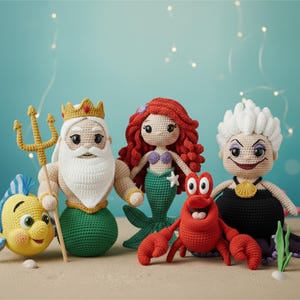 May include: A collection of handmade crochet dolls featuring characters from a popular animated film. The dolls include a yellow fish, King Triton with a golden trident, a mermaid with red hair, a red crab, and Ursula with white hair.