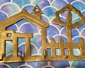 Gancho de pared vintage de latón macizo para llaves.