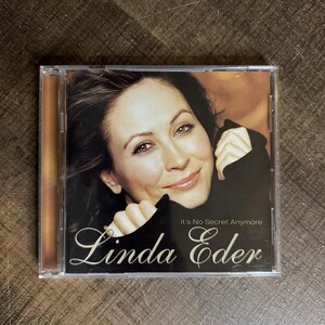 May include: A music CD in a clear plastic jewel case featuring a portrait of Linda Eder on the cover. The artist is wearing a black sweater and smiling. The text on the cover reads Linda Eder and the album title It's No Secret Anymore.