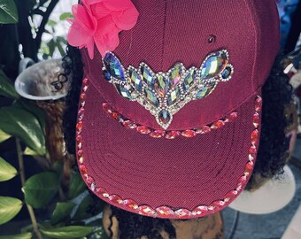 Burgundy trucker hat with embellishments to enhance your look