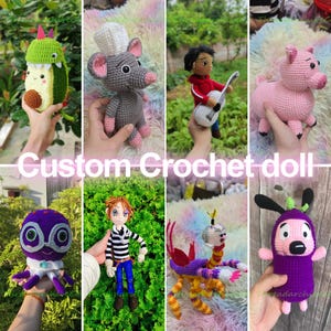 May include: A collection of eight handmade crochet dolls featuring various characters including an avocado dinosaur, a grey mouse chef, a boy with a guitar, a pink pig, a purple octopus, a boy with orange hair, a multi-colored creature, and a purple figure.