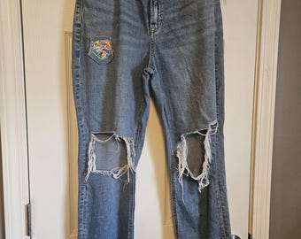 American Eagle peace jeans with tassels