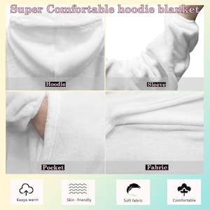 May include: White hoodie blanket with a hood, sleeve, pocket, and soft fabric. The blanket is designed to keep you warm and is skin-friendly. The text "Super Comfortable hoodie blanket" is at the top.
