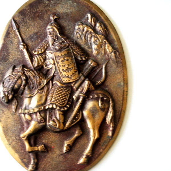 Rare vintage 1970, heavy brass, oval shape, large wall plaque with a sculptured image of the  medieval chinese soldier  and horse.