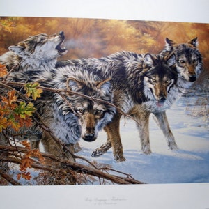 May include: A print of a painting depicting four grey wolves in a snowy forest setting. The wolves are howling and appear to be in a pack. The background features a mix of brown and yellow leaves and snow.