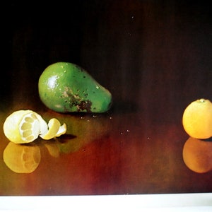 May include: A still life painting of a green avocado, a peeled lemon, and an orange on a dark brown surface.