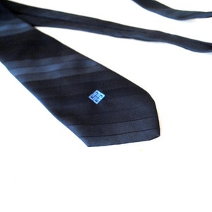 Luxurious vintage 80s dark navy blue polyester necktie with a light blue logo. Made by Givenchy. image 1