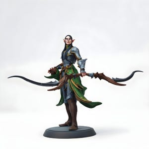 May include: A detailed figurine of an elf archer, standing on a circular base. The figure wears green and silver armour and holds a bow. The archer has long black hair and pointed ears, with a serious expression.