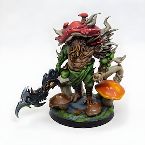 May include: A detailed figurine of a fantasy creature with a red mushroom-shaped head, green clothing, and a brown beard. The figure holds a black sword and stands on a base with mushrooms and foliage. The color palette includes shades of green, brown, and red.