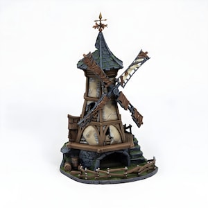 May include: A miniature windmill model with a weathered appearance. The structure features a stone base, wooden accents, and a dark green roof. The windmill blades are brown and appear worn. A small fence and barrel are at the base. The model is set against a white background.