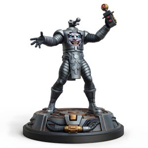 May include: A metallic gray figurine of a robot-like figure with a menacing face and outstretched arms. The figure is holding a device with a red light. It stands on a circular base with mechanical details.