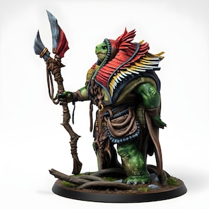 May include: A detailed miniature figure of a reptilian humanoid warrior, painted in shades of green, brown, red, and yellow. The figure holds a spear with a red and gray blade. The warrior is adorned with ornate armor and stands on a base with a naturalistic terrain.