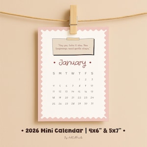 May include: A pink mini calendar for January 2026, held by a wooden clothespin. The calendar has a scalloped edge and features the days of the month, with a quote at the top. The calendar is 4x6 inches and 5x7 inches.
