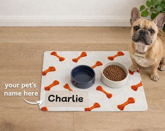 Tapete para comida de mascotas con diseño de juguete de cuerda naranja, mantel individual personalizado para comedero de perro / 12x18