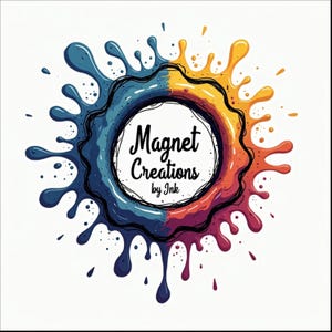 May include: A colorful logo design featuring a circular splash of blue, orange, and purple paint. The text "Magnet Creations by Ink" is centered within a white circle, surrounded by the vibrant paint splatters.