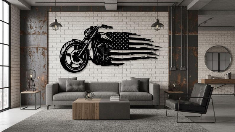 May include: Black metal wall art depicting a motorcycle with an American flag design. The motorcycle is detailed with a large front wheel and engine. The flag design is stylized with flowing stripes. The art is mounted on a white brick wall.