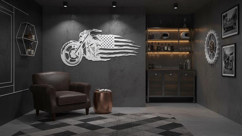 May include: A metal wall art piece depicting a motorcycle with an American flag design. The artwork is mounted on a dark gray wall in a room with a leather armchair, a copper side table, and a bar area with liquor bottles.