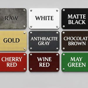 May include: Nine rectangular metal signs with different color finishes and text. The signs include colors like raw, white, matte black, gold, anthracite gray, chocolate brown, cherry red, wine red, and may green. Each sign is secured with four silver rivets.