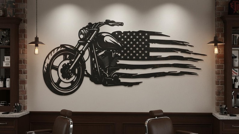 May include: Black metal wall art featuring a motorcycle design integrated with a distressed American flag. The motorcycle is detailed with visible engine components and a large front wheel. The artwork is mounted on a neutral-colored wall.