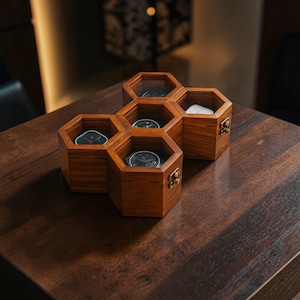 May include: A wooden watch organizer in a honeycomb design. The organizer is made of dark wood and features six hexagonal compartments, each with a clear top. Several watches are visible inside the compartments, and the organizer sits on a dark wooden surface.