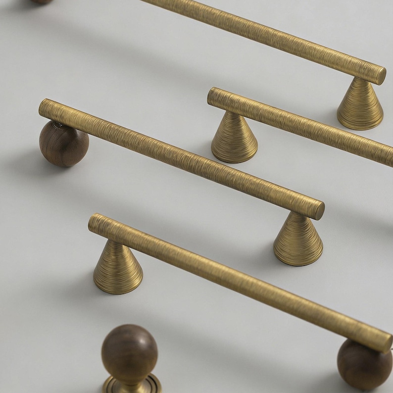 May include: A white ceramic mug with a black handle and the text "But First, Coffee" in a black, bold font. The mug is on a white surface.