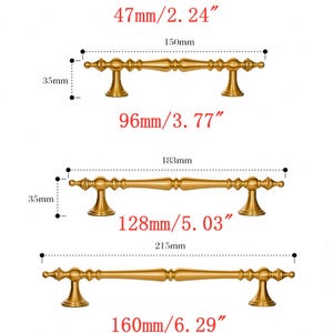 May include: Image of various antique brass cabinet hardware. Includes a round pull with a floral design, and three different sizes of bar pulls. Measurements are provided in inches and millimeters.