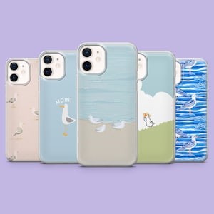 May include: Five phone cases with different designs. One case has a pattern of seagulls, another says "MOIN!" with a seagull, and others feature beach scenes with seagulls. The cases are clear with colourful illustrations.