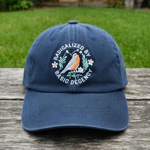 Radicalized By Basic Decency Hat, Embroidered Bird Baseball Cap, Kindness Activist Gift, Navy Blue Dad Hat, Floral Bird Graphic Cotton Cap