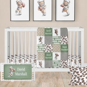 May include: A green and brown baby crib bedding set with a football theme. The set includes a quilt, a fitted sheet, a crib bumper, and a pillow. The quilt features a patchwork design with brown footballs and green squares with the words "Football" printed on them. The fitted sheet and crib bumper have a brown football pattern. The pillow is brown with a football pattern. The set is personalized with the name "David Marshall".
