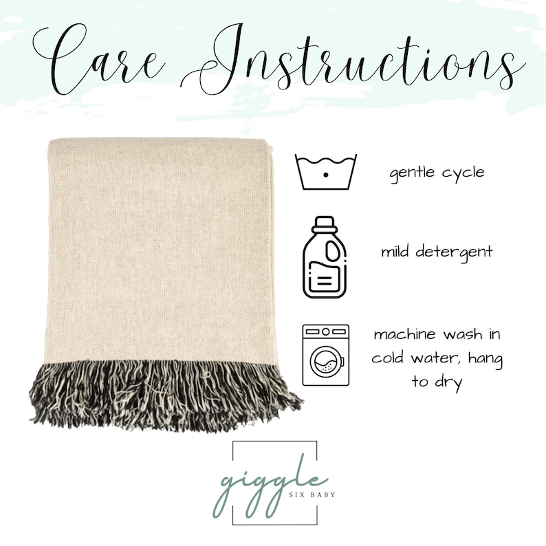 May include: A beige throw blanket with black fringe, featuring care instructions with icons for gentle cycle, mild detergent, and machine wash in cold water, hang to dry. The text Care Instructions and the brand name giggle SIX BABY are visible.