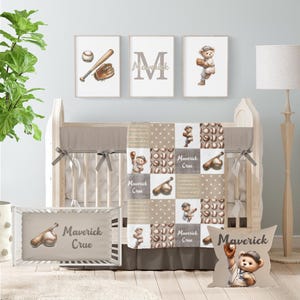May include: A baseball-themed nursery set featuring a crib, bedding, and decorative wall art. The set includes a crib bumper, quilt, and pillow with baseball and teddy bear illustrations. The wall art includes a baseball, glove, and bat.