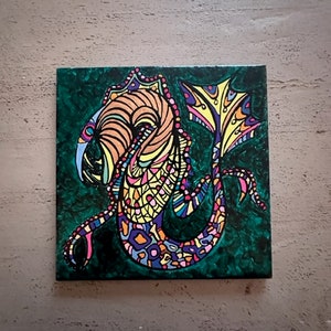 hand painted sea creature artwork on ceramic tile