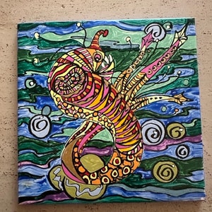 Hand painted sea creature on ceramic tile