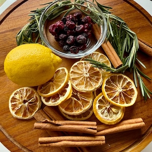May include: A white ceramic mug with a black handle and the text "But First, Coffee" in a handwritten style. The mug is on a white surface. The mug is likely 11 ounces.