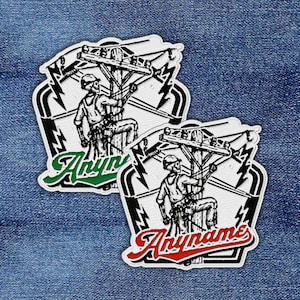 May include: Two embroidered patches featuring a lineman on a utility pole with lightning bolts. One patch has green text that says "Anyname", and the other has red text that says "Anyname". The patches are white, black, and gray.