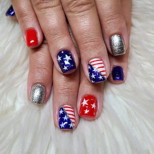 May include: A set of three ceramic mugs with a speckled, matte finish. The mugs are in shades of cream, light gray, and dark gray. Each mug has a simple, minimalist design, perfect for coffee or tea.