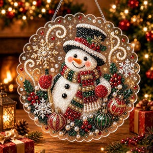 May include: A circular hanging decoration featuring a beaded snowman wearing a black top hat with red holly, a red and green plaid scarf, and two black buttons. The snowman holds a gold staff with a snowflake, surrounded by red and green ornaments.