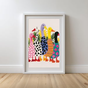 May include: A framed art print featuring five ducks standing in a row. The ducks have colourful, patterned bodies including pink with white dots, black and white spots, blue and black leopard print, orange stripes, and teal with pink circles.