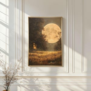May include: A framed landscape painting depicts a large, glowing full moon over a field of wildflowers and a forest. A small, illuminated building is nestled in the trees. The artwork is in a gold frame and has a warm, inviting color palette.