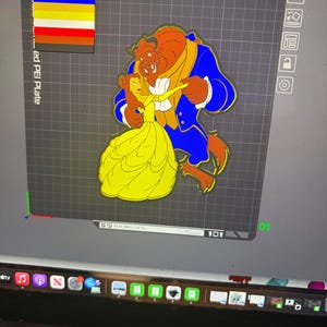 May include: A colorful illustration of the Beast and Belle from Beauty and the Beast. The Beast is in a blue coat and Belle is in a yellow dress. The image is on a gray grid background with color swatches in the upper left corner.