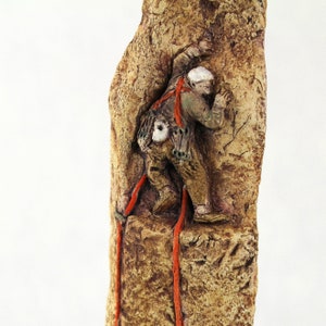 Stoneware Rock Climber Sculpture: Hand-Painted Ceramic Art