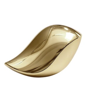 May include: A gold-colored, leaf-shaped decorative bowl. The bowl has a smooth, reflective surface and a curved, organic design. The interior of the bowl is also gold, creating a cohesive and elegant aesthetic. The bowl is likely made of metal.