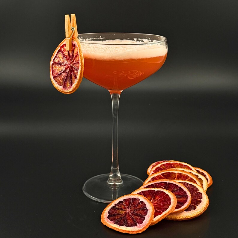 Style your sips. A dried citrus slice turns any drink into an experience — perfect for margaritas, spritzes, or festive mocktails Bulk Dehydrated Blood Orange Slices - Dried Ruby Red Orange for Cocktails and Decor 80+ pieces for party planners