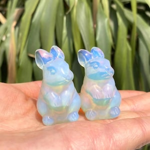 May include: A set of three ceramic mugs with a speckled, matte finish. Each mug features a different color: light blue, cream, and gray. The mugs have a simple, modern design, perfect for coffee or tea.