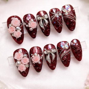 May include: A white ceramic mug with a black handle and the text "But First, Coffee" in a black, bold font. The mug is sitting on a white surface. The mug is approximately 4 inches tall.