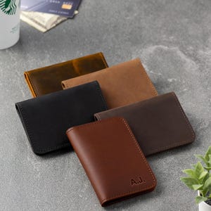 Man opening the ID window wallet to show card capacity